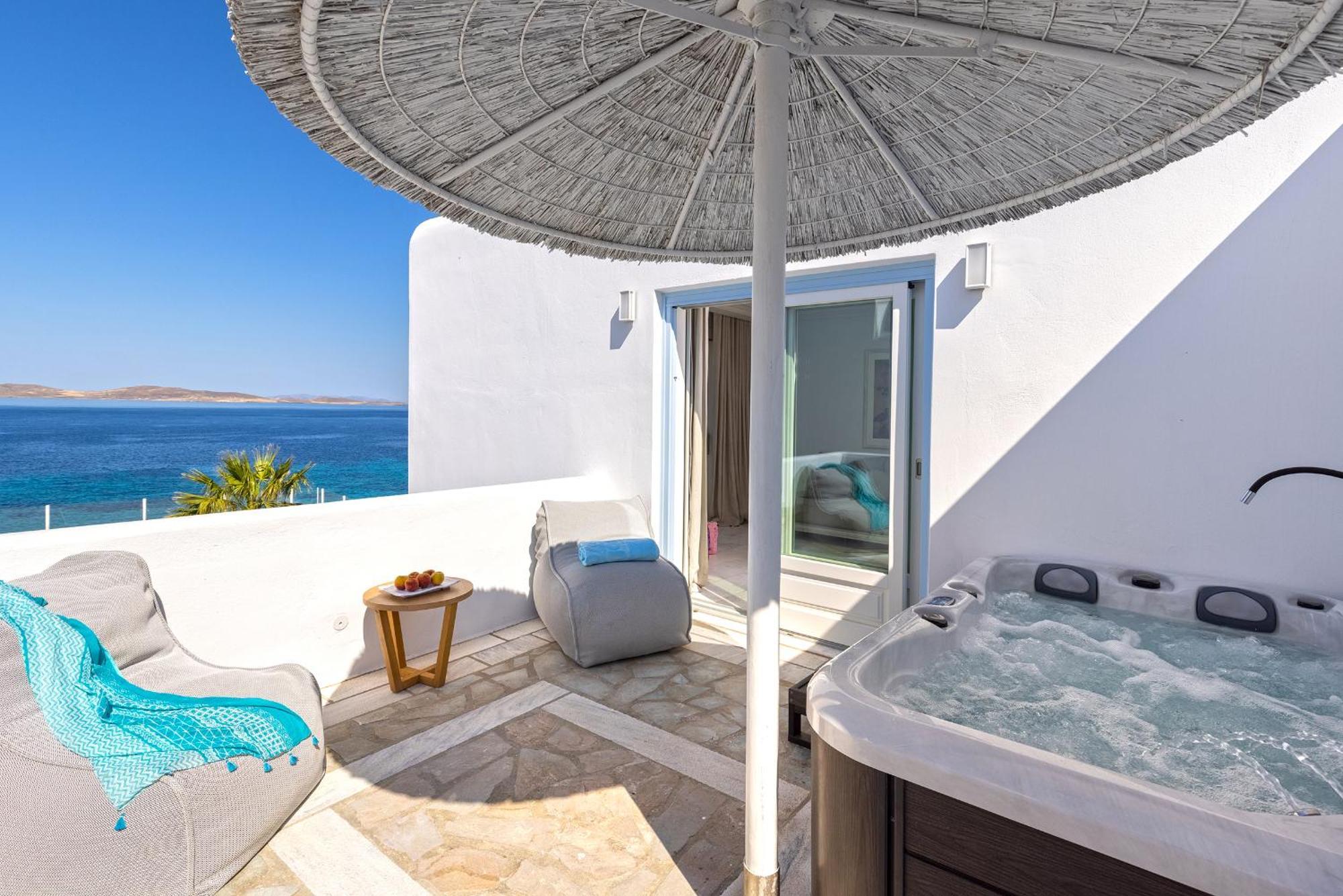 Saint John Hotel Villas&Spa Agios Ioannis Diakoftis Esterno foto A private hot tub at a hotel in Mykonos, Greece